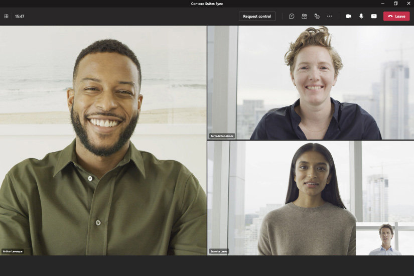 A group of people join a Microsoft Teams call on a Surface Pro 9