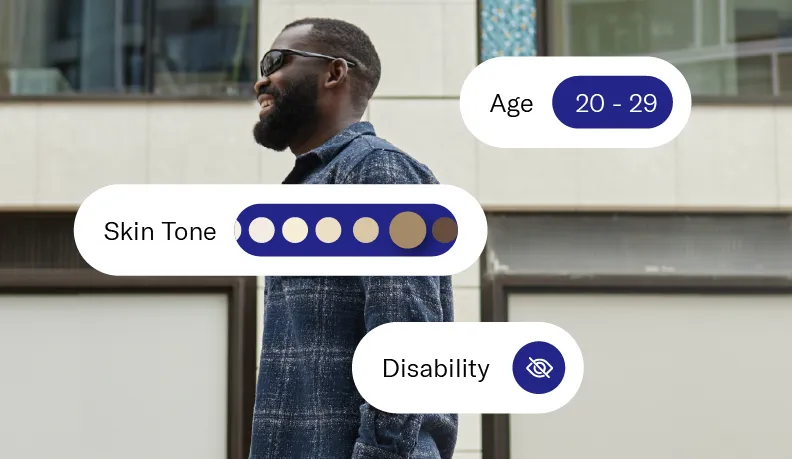 Man walking with a white cane in an urban setting, with overlaid labels indicating ‘Skin Tone’, ‘Disability’, ‘Age 20-29’, and ‘Gender Expression Male