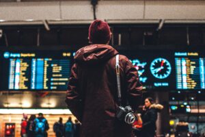 Person standing in travel station