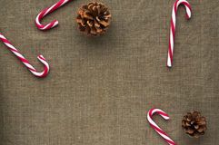 photo christmas-decorations-top-view-candy-canes-composition-cones-linen-fabric-background-63332161_zpsu4r0ff5m.jpg: 