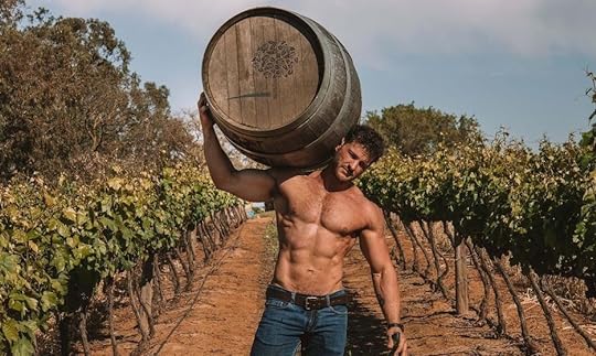 hot shirtless guy in vineyard carrying a wine barrel. 