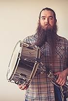 Mark Amos, carrying his own drum.