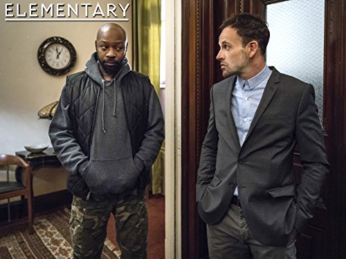 Jonny Lee Miller and Nelsan Ellis in Elementary (2012)