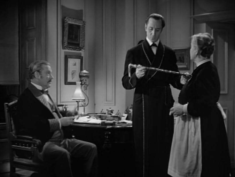 Basil Rathbone, Nigel Bruce, and Mary Gordon in The Hound of the Baskervilles (1939)