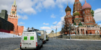 RT vans parked outside the Kremlin