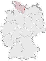 Lübecks (mörkrött) läge i Tyskland och Schleswig-Holstein (ljusrött).