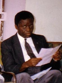 Lihau seated with papers in his hands