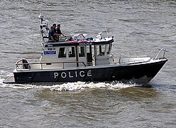 A boat of the Metropolitan Police on the River Thames, London