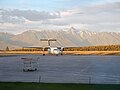 An Air Canada Express Dash 8-Q300 taxiing up to the terminal