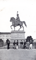 Grote in front of the statue of Ernst August, king of Hannover, 1st duke of Cumberland at Hannover. Grote holds the manuscript of the Althannoverscher Volkskalender in his hands.