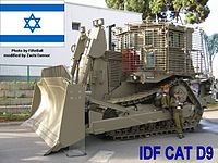 IDF armored D9R with add-on slat armor against anti-tank weapons, in LIC 2005 exhibition (with Flag of Israel)