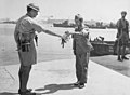 Image 3330 August 1945. Yokosuka Naval Base, Tokyo Bay. Commander Yuzo Tanno hands over the keys of Yokosuka Naval Base to Captain H. J. Buchanan, Royal Australian Navy. Buchanan led the first Commonwealth party to go ashore in Japan. (from History of the Royal Australian Navy)