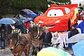 Le laétaré de Sart-Tiège : un char fleuri tire par des chevaux ardennais.