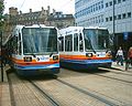 Two Supertram vehicles in the Stagecoach corporate livery worn between 1997 and 2006.