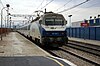 An Arco train passes Alzira station in 2006