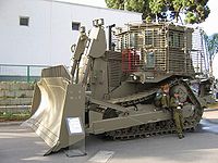 IDF armored D9R with add-on slat armor against ATGM & RPG, in LIC 2005 exhibition