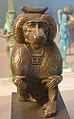 statue at Louvre with plaque-amulet necklace