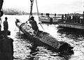 Image 36A Japanese Ko-hyoteki-class midget submarine, believed to be Midget No. 14, is raised from Sydney Harbour (from History of the Royal Australian Navy)