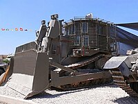 IDF armored D9R with add-on slat armor against anti-tank weapons, in Israel's 60th Independence Day (processed version of File:D9R-002.jpg)