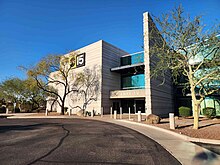 A two-story office building with ABC15 logo signage