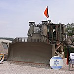 IDF D9R with slat armor and FN MAG