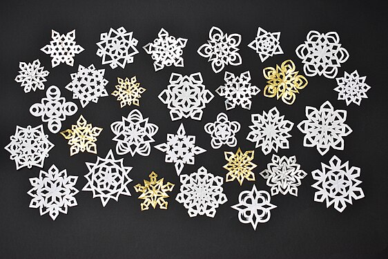 Handmade paper snowflakes with 4, 5, 6, 7 or 8 "arms".