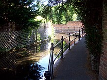 A photograph of a shallow stream flowing round an s-bend