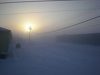 Fog caused by the burning of hydrocarbons to heat houses in the Arctic. The fog forms around communities when the temperature reaches -40 °C. At the time this was taken the temperature was -43 °C.