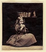 Young girl holding a bird