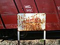 Rusted and pitted sign railway safety sign, Da Nang.