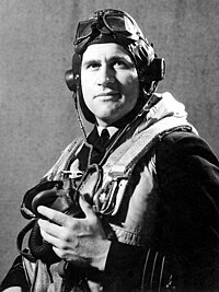 Half portrait of man in dark-coloured uniform with flying goggles