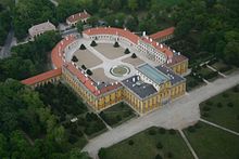 Aerial view of a palace around a large courtyard