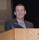 Armstrong speaking to cancer researchers.