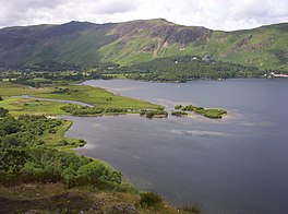 A lake with a ridge of hills in the background