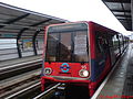 A B90 stock pulling into Pontoon Dock DLR station.