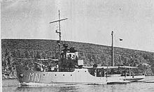 a black and white image of a ship underway