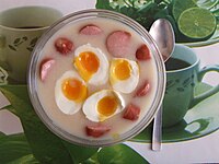 Żur with kiełbasa and halved boiled eggs