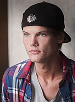 Black-and-white photo of Avicii smiling