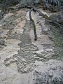 Erosion on a sandstone hillside.