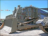 IDF armored D9R with add-on slat armor against anti-tank weapons, in Israel's 60th Independence Day (processed version of File:D9R-002.jpg)