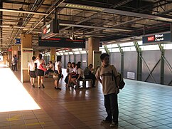 View of passengers at the old platform without platform screen doors