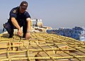 Image 68A sailor from HMAS Adelaide inspecting a ship in the Persian Gulf during 2004 (from History of the Royal Australian Navy)