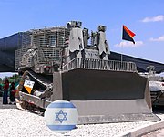 IDF armored D9R with add-on slat armor against anti-tank weapons, in Israel's 60th Independence Day (processed version of File:D9R-001a.jpg)