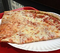 Slices of New York-style pizza