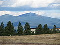 A wooded mountain in the distance