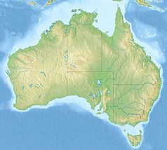 Mapa konturowa Australii, blisko lewej krawiędzi nieco u góry znajduje się punkt z opisem „Wyspa Barrowa”