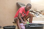 Thumbnail for File:Boy washing cloth.jpg