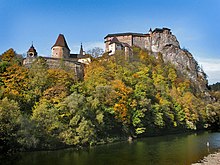 A fortress built on a cliff over a river