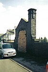 The bricked-up entrance to Belgrave and Birstall station in 2003