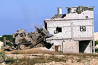 IDF D9L razing a house during the Second Intifada